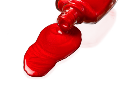 Red glitter nail polish spilled