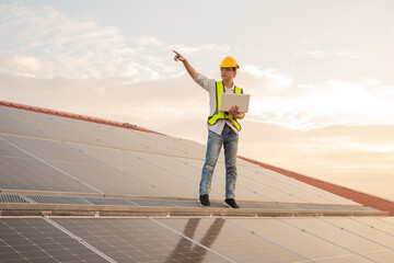 Service Engineer use tablet working inspection installation solar cell on the roof, Technology solar energy renewable.