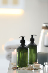 Soap dispensers and decor elements on table