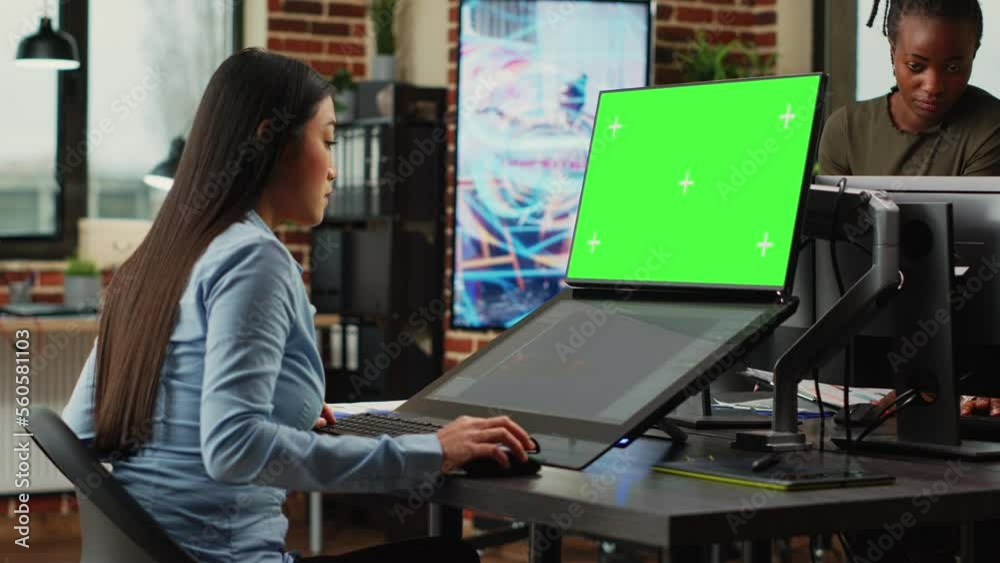 Poster creative agency employee looking at greenscreen and 3d developing software on touchscreen monitor. w