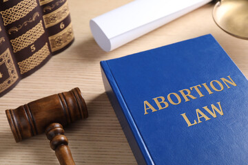 Abortion Law book and gavel on wooden table