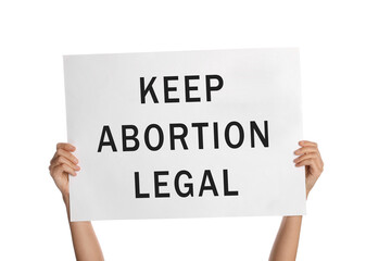 Woman holding placard with phrase Keep Abortion Legal on white background, closeup. Abortion protest