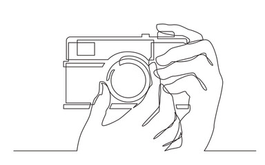 continuous line drawing hand holding photo camera making pictures - PNG image with transparent background