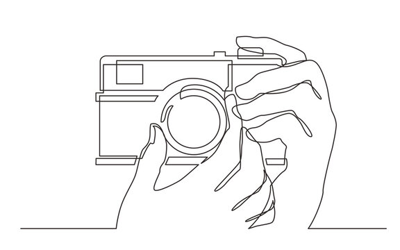 continuous line drawing hand holding photo camera making pictures - PNG image with transparent background