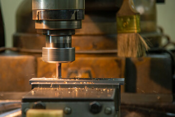 The milling process with the metal plate parts on NC milling machine.