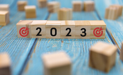 Express the process of changing to 2023 with wooden BLOCK