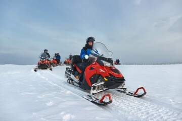 Fototapeta na wymiar Snow mobile trip in Lapland