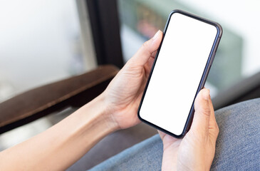 cell phone blank white screen mockup.hand holding texting using mobile on desk at office.background empty space for advertise.work people contact marketing business,technology
