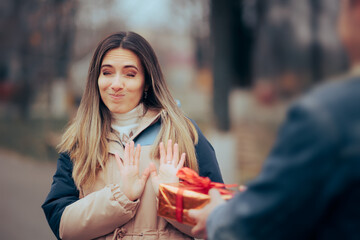 Woman Refusing Politely an Unexpected Gift from her Admirer. Girl not receiving any presents from...