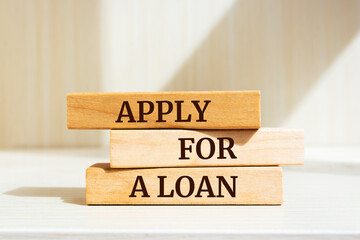 Wooden blocks with words 'Apply For a Loan'.