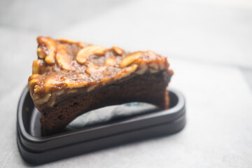 The taste is sweet and delicious chocolate cake brownies with cashew nuts. Close up
