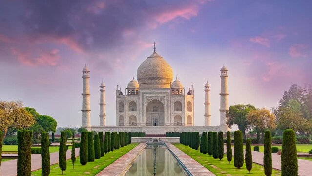 4K time lapse of Taj Mahal, an ivory-white marble mausoleum on the south bank of the Yamuna river in Agra, Uttar Pradesh, India. One of the seven wonders of the world.