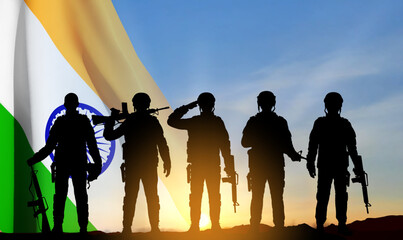 Silhouettes of soldiers with India flag on a background the sunset. Concept for National Holidays. EPS10 vector