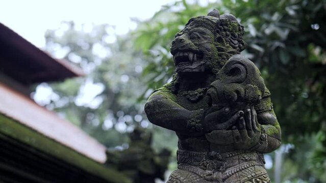 statue of an evil monkey in the forest
