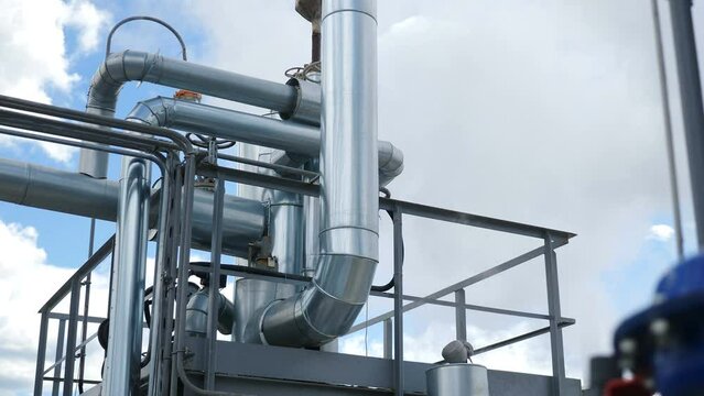 Refinery chemical factory. Modern equipment, steel tanks and boilers with cables, pipelines and valves for chemical mixing. Production of anti-turbulent additives used in oil industry. 4 k video