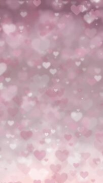 Pink glitter heart pattern background. Seamless loop footage.(019_rose pink_vertical)