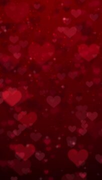 Red glitter heart pattern background. Seamless loop footage.(019_red_vertical)