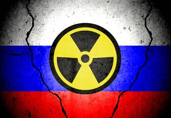 Russian flag on a wall and nuclear alarm sign.
