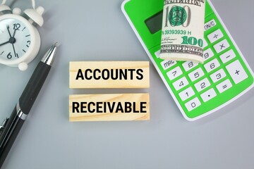 calculator, pen, paper money and alarm clock with the word Accounts receivable. the concept of payment has not been accepted
