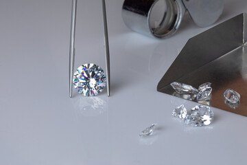 Process of evaluating diamond at diamond dealers workplace. High quality photo