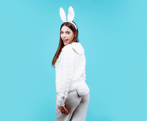 Easter bunny girl. Happy Easter. Funny girl with bunny ears on Easter card, isolated.