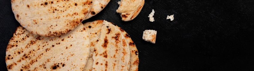 .Pita bread on dark background. Arabic, lebanese bread, traditional food.