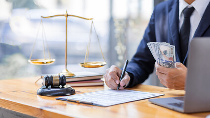 Close up of photo lawyer male notary working in a courtroom on wooden table office, Legal law, advice deal justice and law concept.