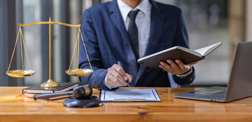 Close up of photo lawyer male notary working in a courtroom on wooden table office, Legal law,...