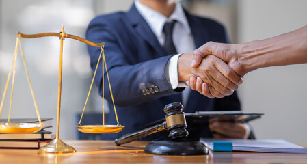 Businessman handshake to seal a deal Judges male lawyers justice and law concept. male lawyer...