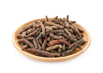 long pepper or piper longum in wood plate isolated on white background. heap of long pepper or piper longum isolated. long pepper, piper longum