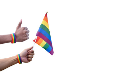 Isolated rainbow flag and rainbow wristband, LGBT symbol, holding in hand with clipping paths.