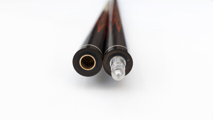 Billiard cues on a white background. Parts of a billiard cue close-up. Live photos of a billiard cue