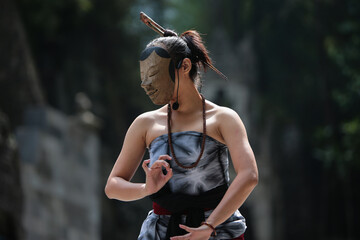 Female Javanese traditional mask dancer, rehearsing in Yogyakarta