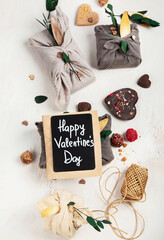 Valentine's Day Zero Waste Concept. Eco-friendly linen packaging as a gift for Valentine's Day in furoshiki style. Simple eco presents plastic free.