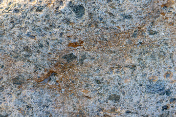 Closeup of the rough texture of a big river stones surface for natural background