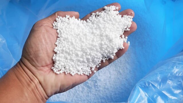 The concept of more expensive chemical fertilizers. White chemical fertilizer formula 46-0-0 focuses on plant growth.