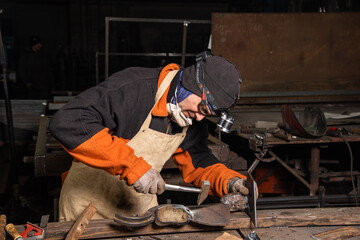 Work in a mechanical workshop with various tools