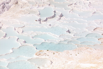 Emerald water in white limestone rock.