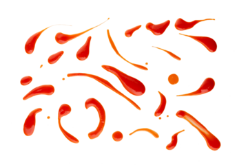 Set of red drops and splashes of ketchup or sauce isolated on white background. With clipping path. Full depth of field. Focus stacking