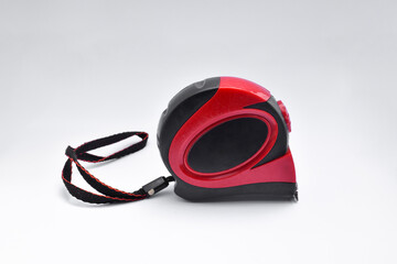 Roll-up metal meter for hobbies and work on a white background