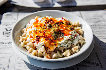 pasta with meat Turkish manty with yogurt mint and boiled butter 