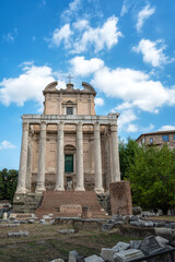Fototapeta na wymiar Ruins of the Temple of Antoninus and Faustina - the front view of the San Lorenzo in Miranda church built inside the antique temple at the Sacred Road in Roman Forum in Rome, Italy