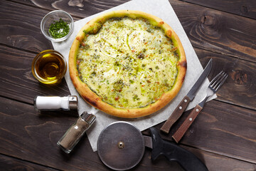 tasty pizza on the wooden background