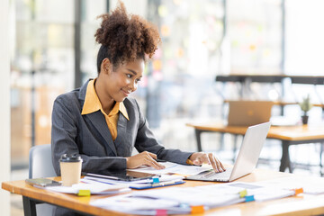 Image of young business african american company worker in hand holding digital tablet, standing over white office background