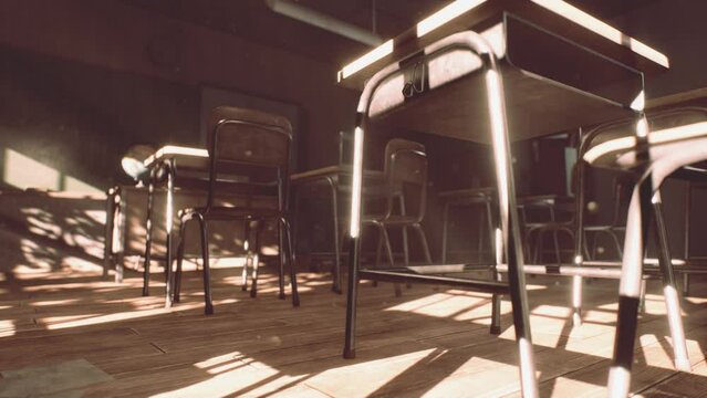 View to classroom with tables and small blackboard and grungy walls