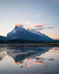 Mount Rundle reflected in Vermilion Lakes at sunrise. Banff. Canadian Rockies. Vertical format.