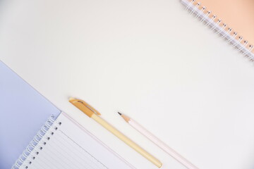 Book, Pencil and Pen on White Background