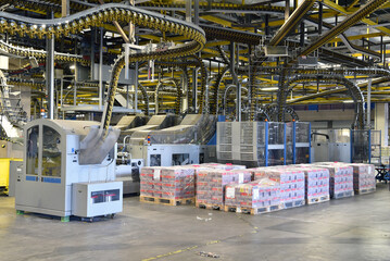 modern machines for transportation in a large print shop for production of newspapers & magazines