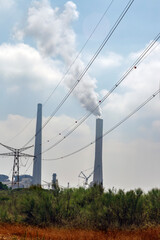 Plant pipe with smoke. High smoke stacks with smoke emission. Plant pipes pollute atmosphere. Industrial factory pollution, smokestack exhaust gases. Industry zone, thick smoke plumes. Bad ecology