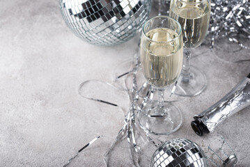 Glass of champagne with disco ball.